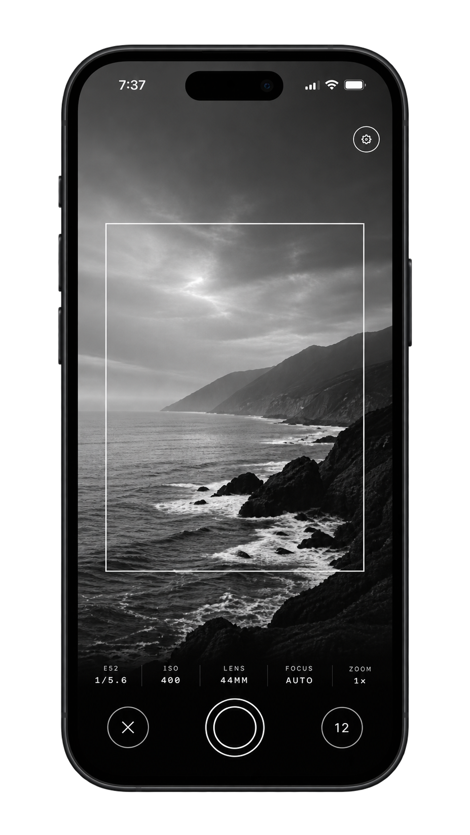 The BW camera viewfinder over a black and white coastline.